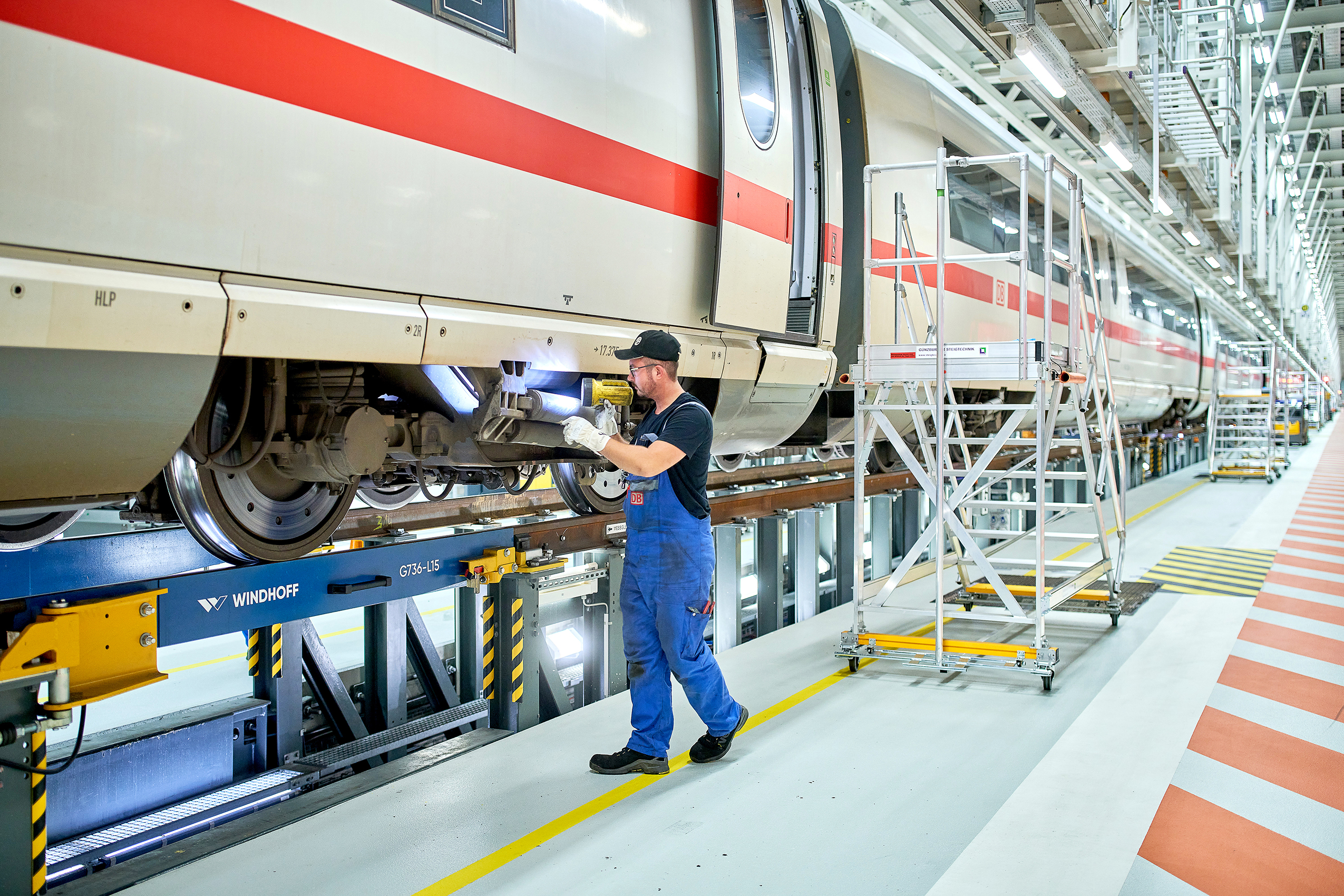 Visual inspection of a yaw damper that ensures stability and comfort on high-speed rides.